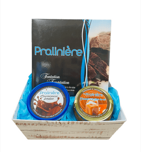 panier-cadeau gourmand contenant une boite de chocolats assortis, une fondue au chocolat et un pot de tartinade au caramel